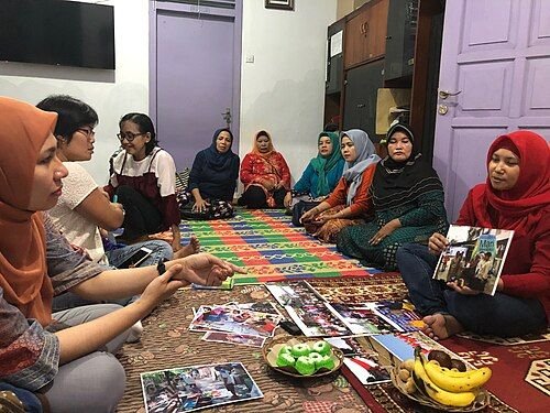 Women discussing together at a community school